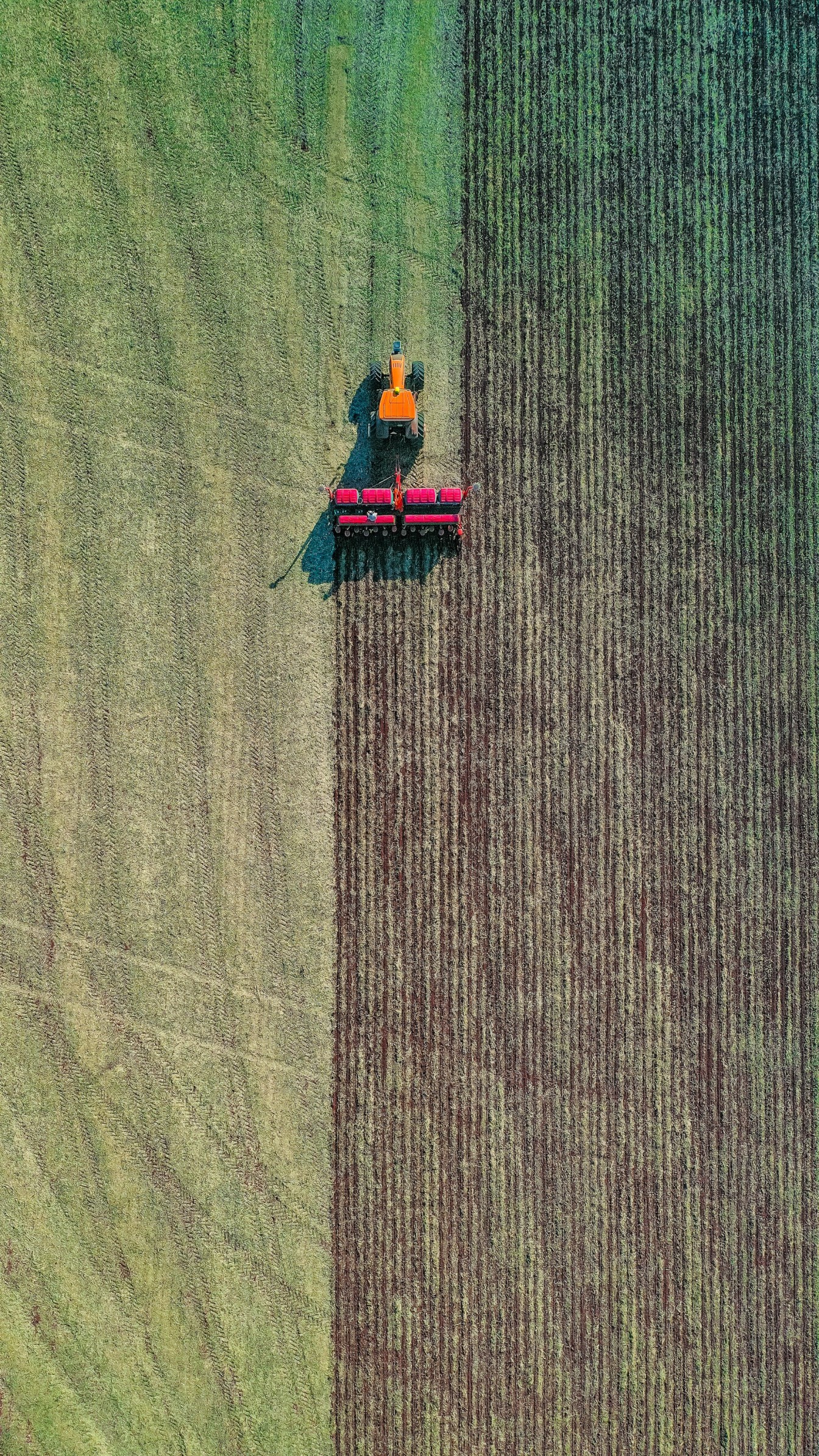 Aerial shot of a tractor pulling a plough